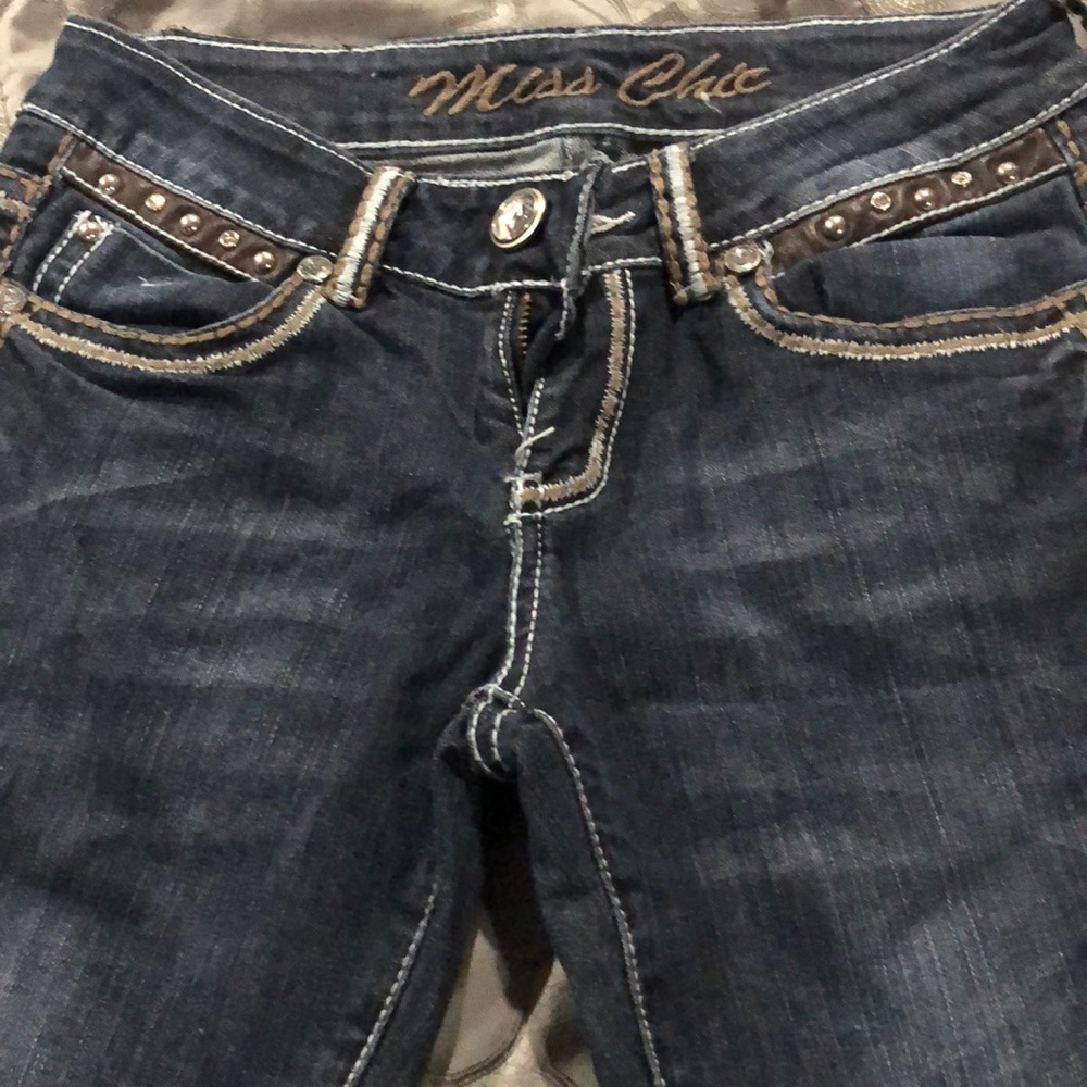 Miss chic jeans  crosses on back pockets.